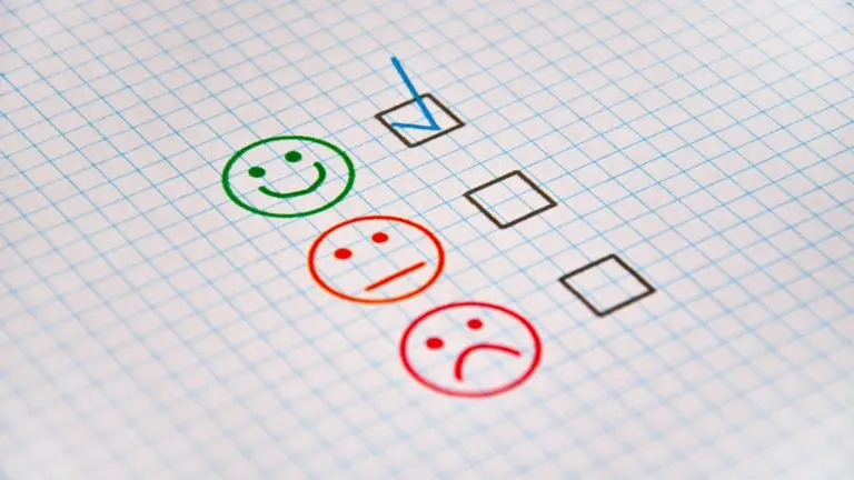 Exam sheet with checkboxes and evaluation faces