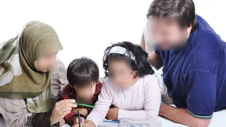 Parents helping their children study at home
