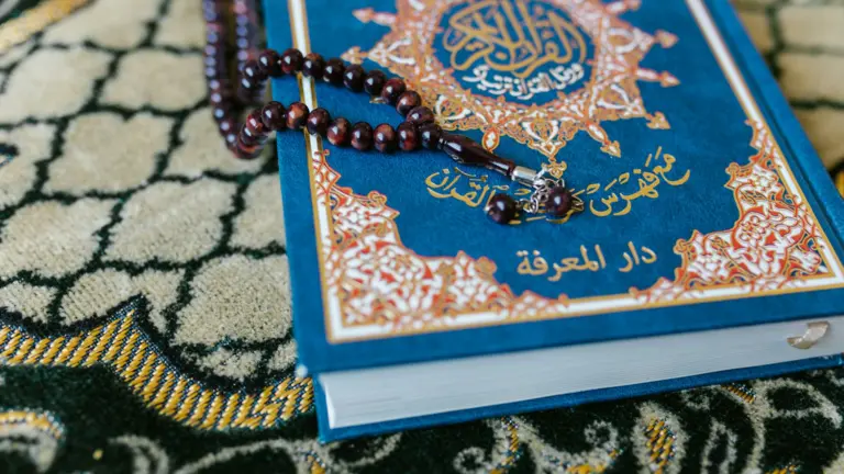 Quran with prayer beads illustrating Quran recitation styles