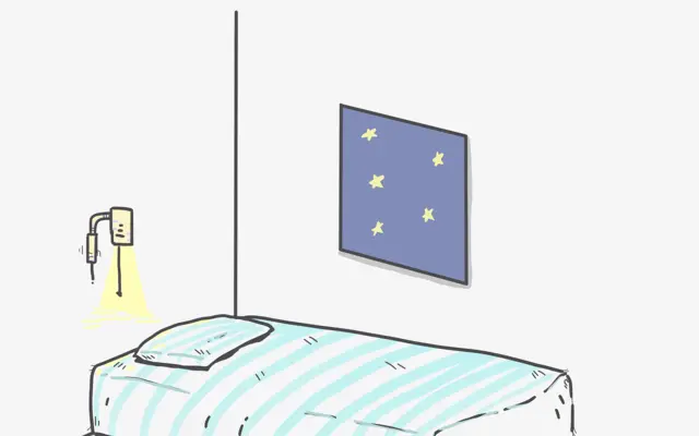 Kuvitettu sänky yöikkunan alla