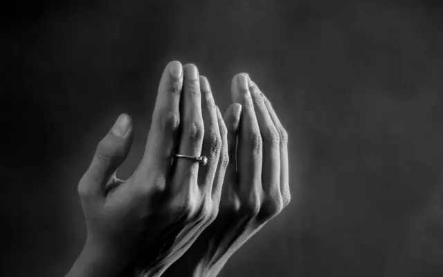 Hands raised in supplication for Istikhara prayer