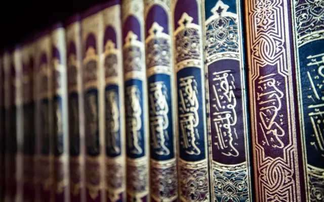 Tafsir books lined up on a shelf